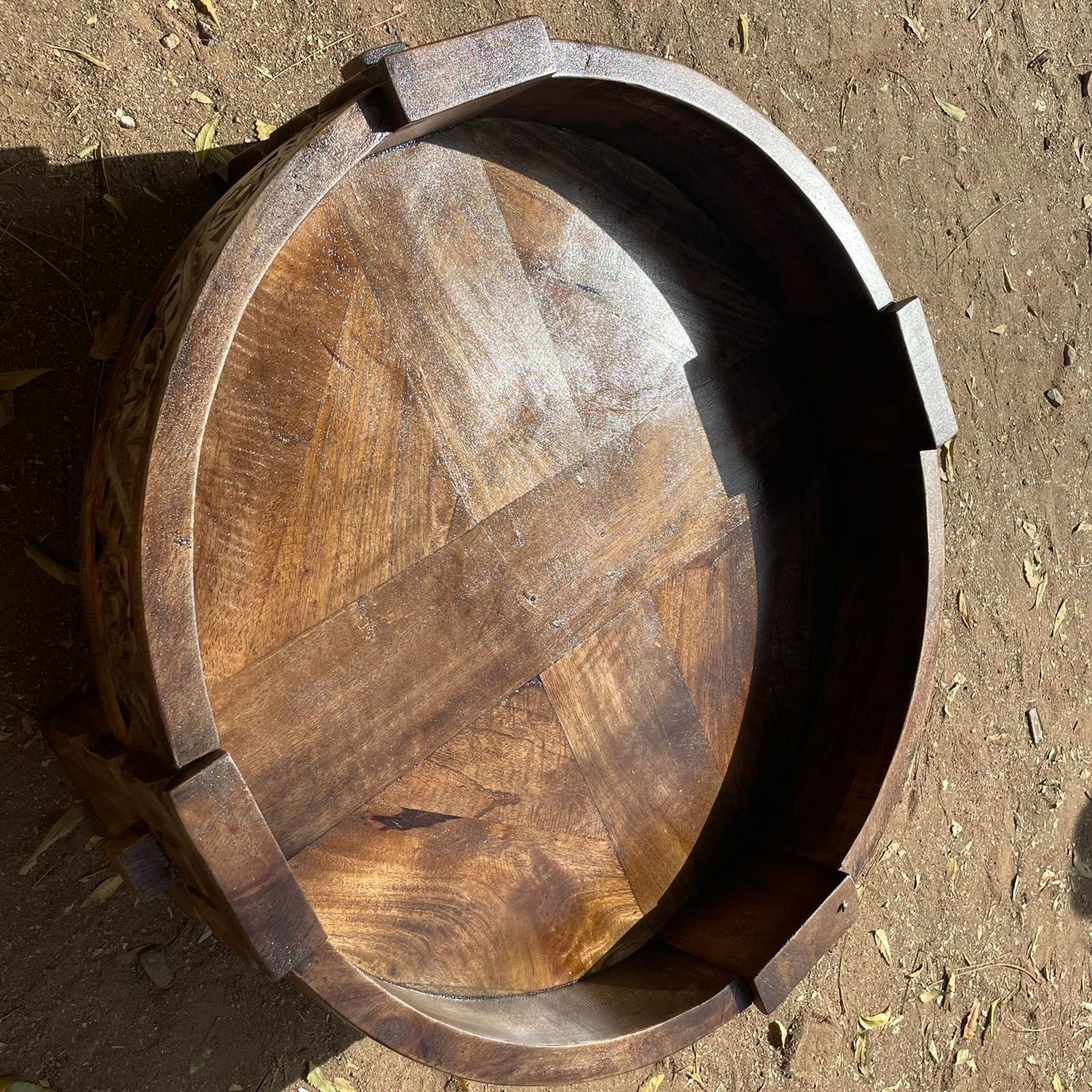 a mirror that is sitting on the ground  a mirror that is sitting on the ground