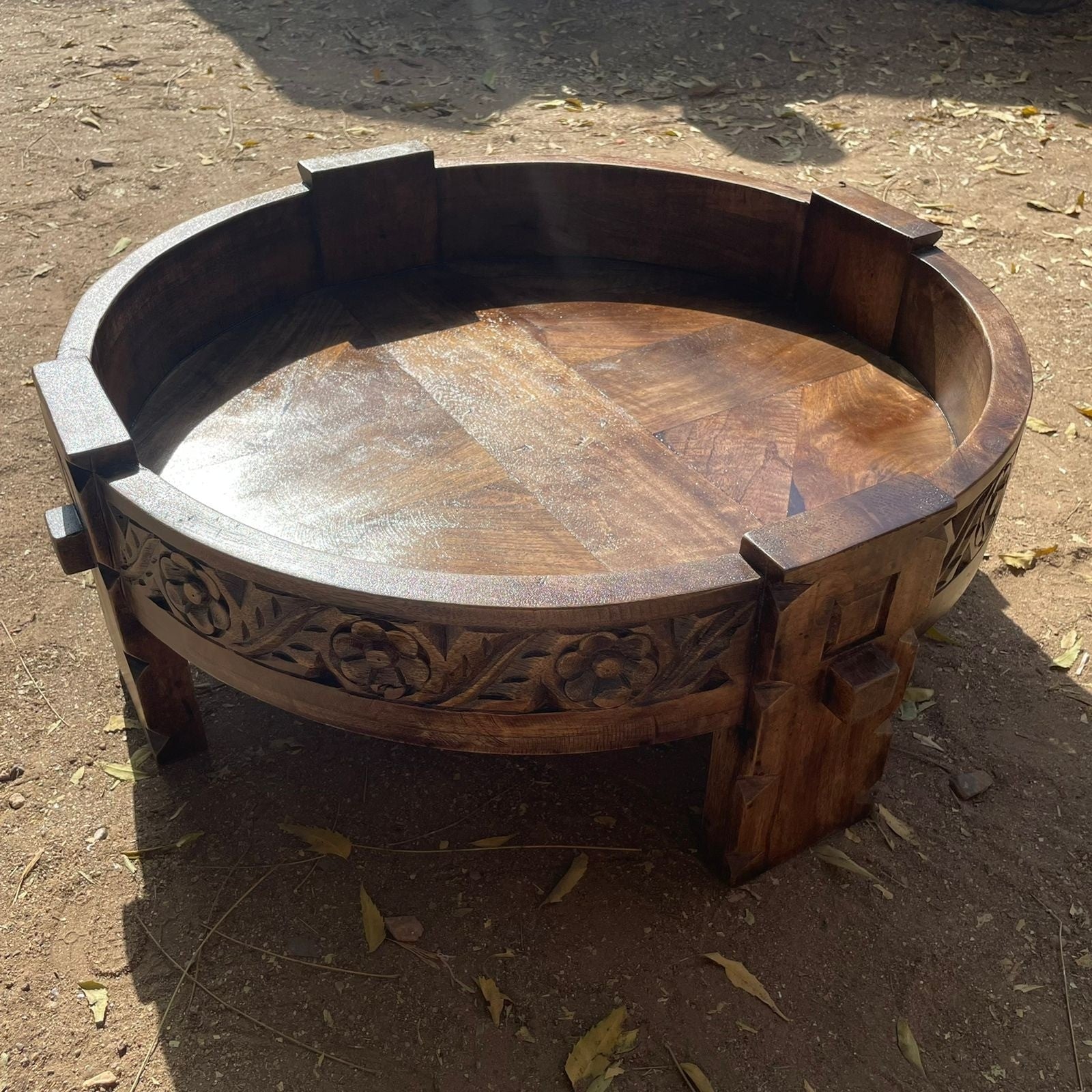a rustic wooden bench sitting on the ground  a rustic wooden bench sitting on the ground