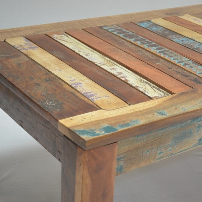 a wooden bench sitting in the middle of a street  a wooden bench sitting in the middle of a street