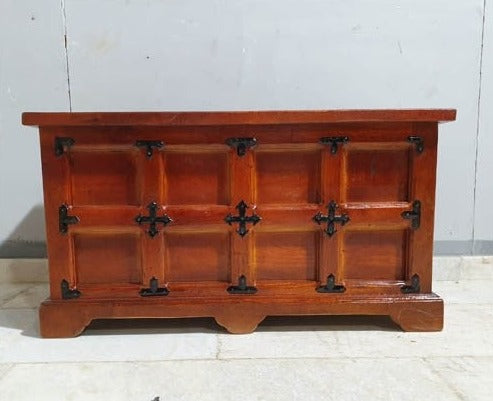 a wooden box on a bench in the snow 