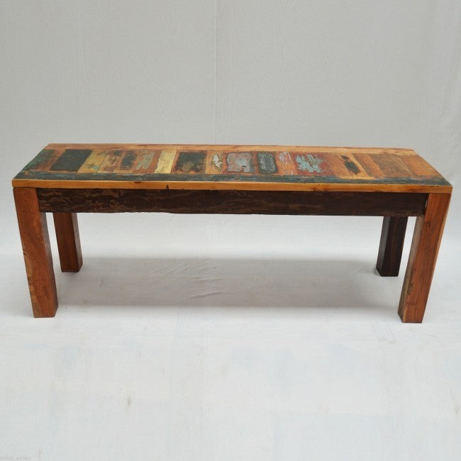 a wooden bench sitting on top of a snow covered ground 