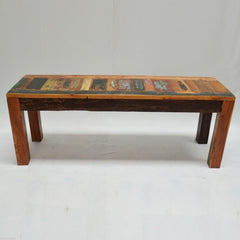 a wooden bench sitting on top of a snow covered ground 