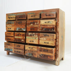 a wooden box filled with wooden trunks on a cart 