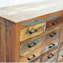 a close up of a dresser with a wooden trunk 