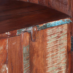 a wooden bench sitting in front of a wooden wall 