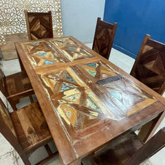 a wooden table topped with a wooden umbrella 