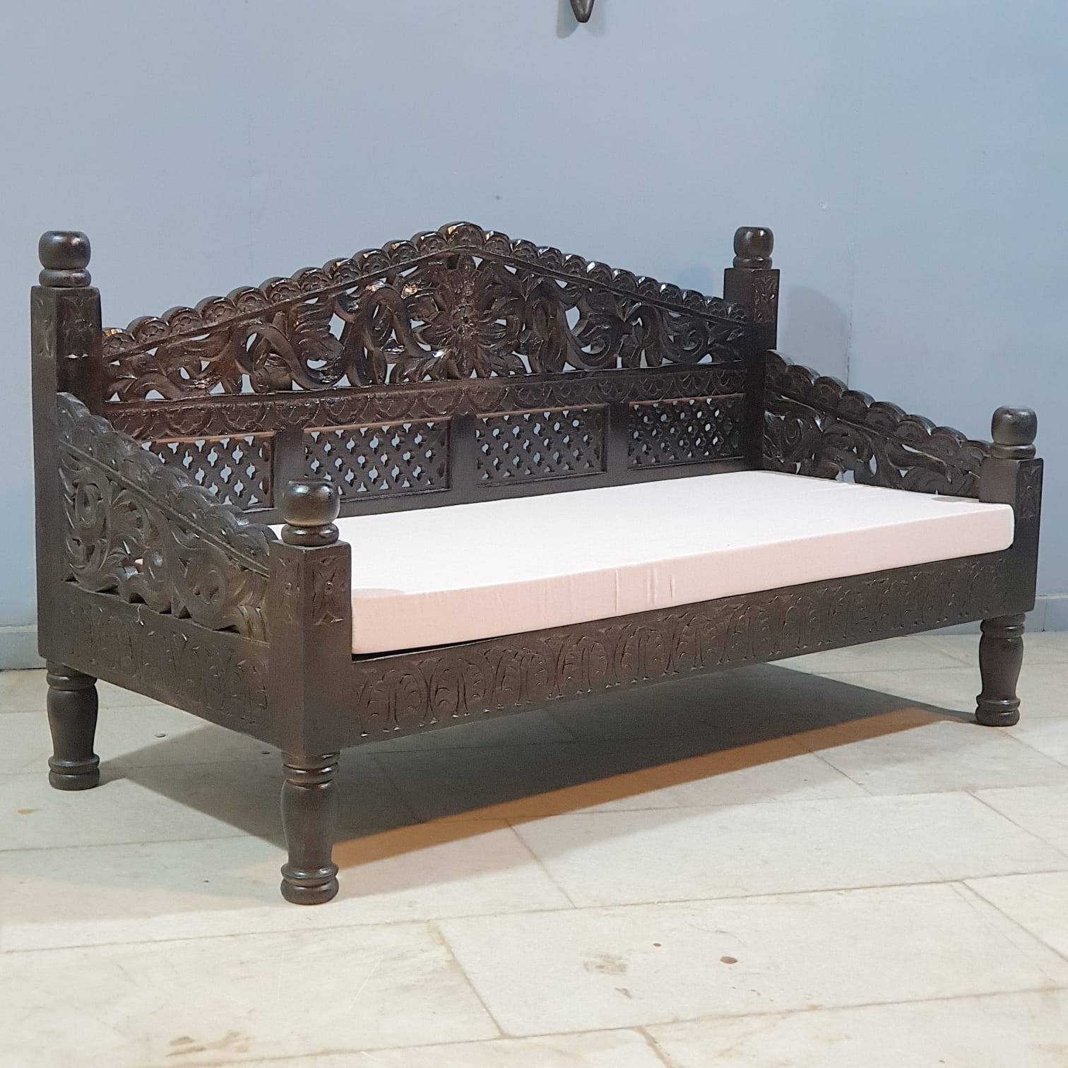 Traditional Indian carved daybed detail