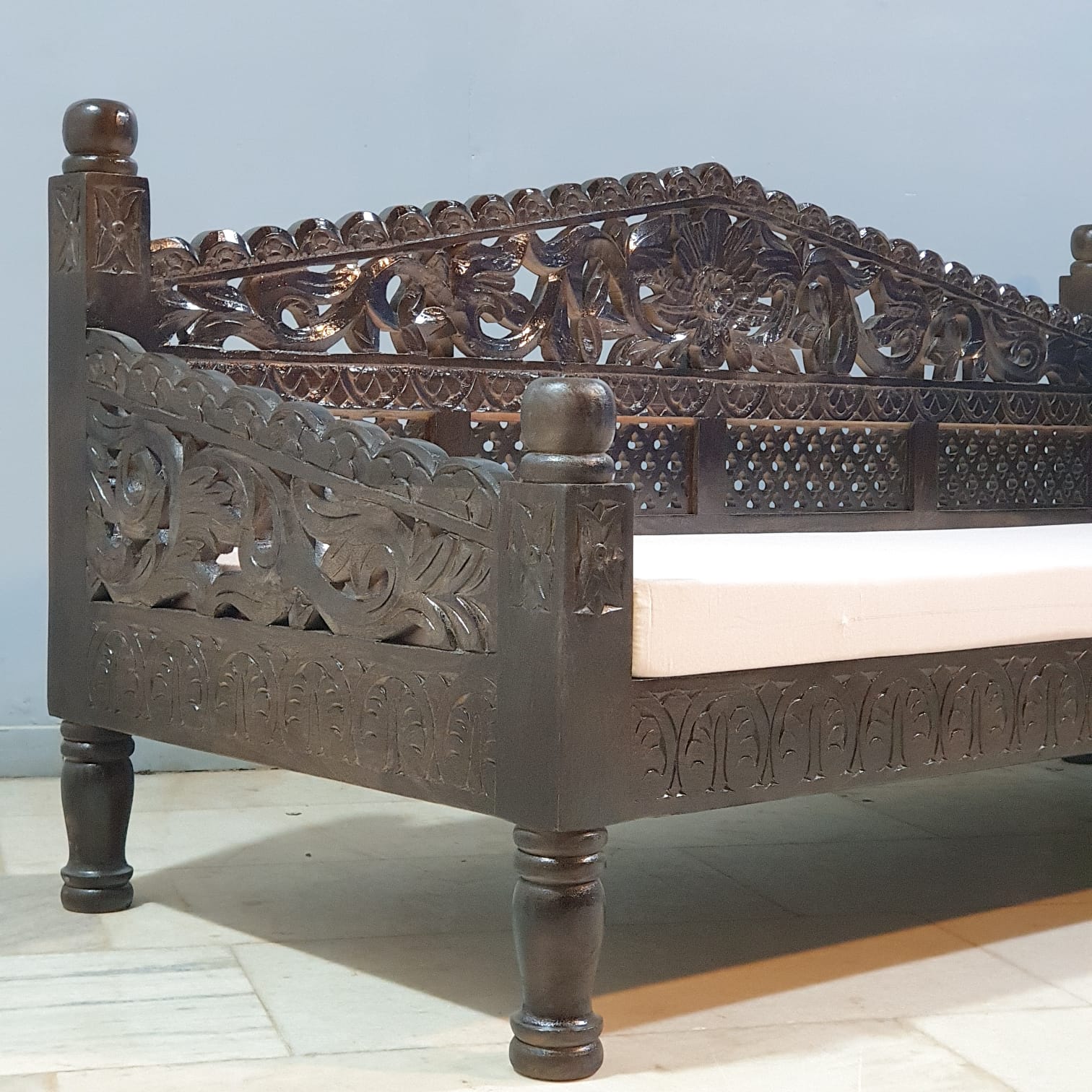 Traditional Indian carved daybed detail carvings