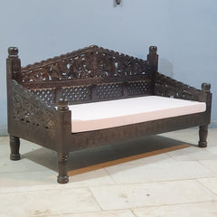 Traditional Indian carved daybed detail