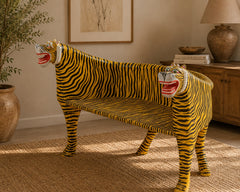 Side view of handcrafted wooden tiger bench