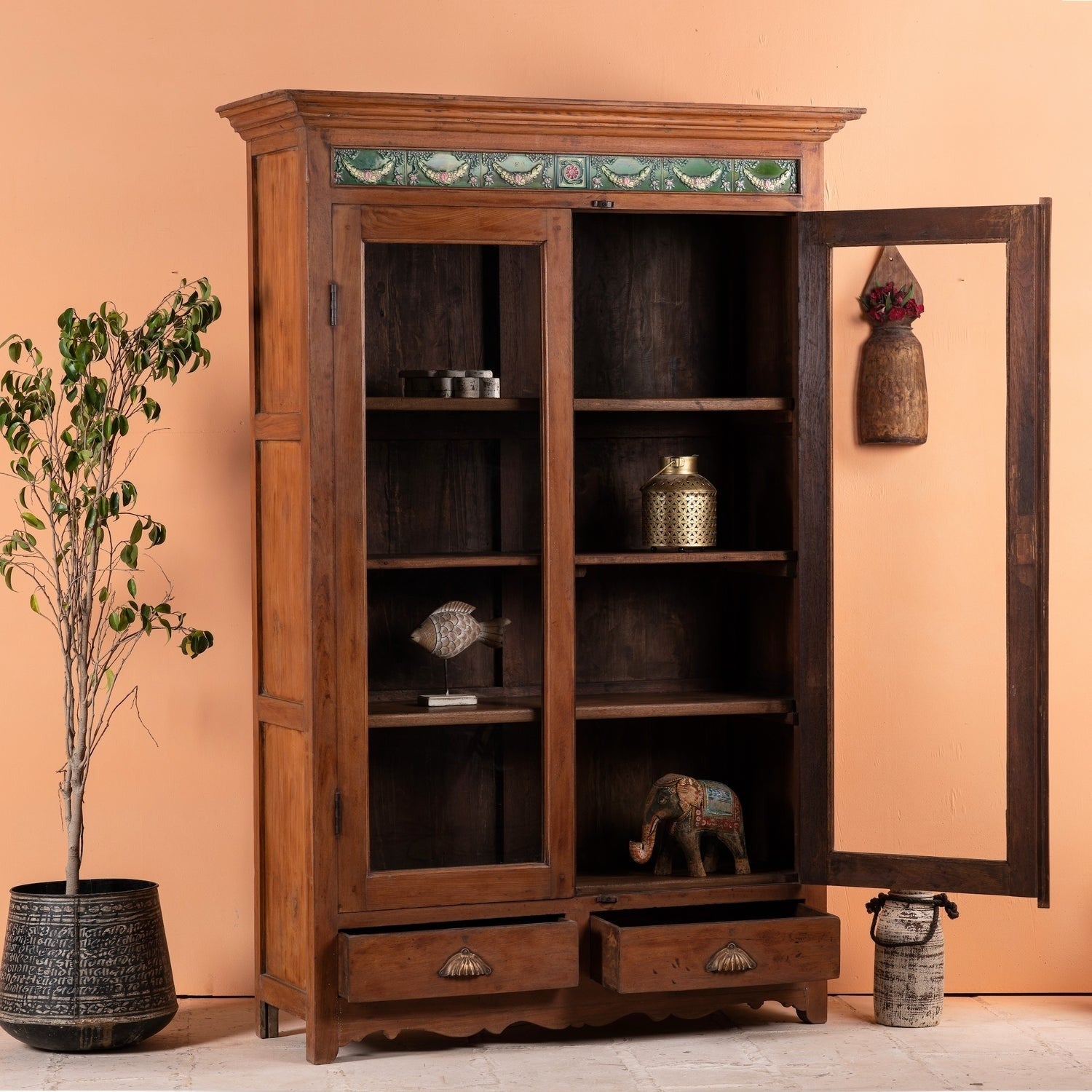 a wooden cabinet with a shelf with books 