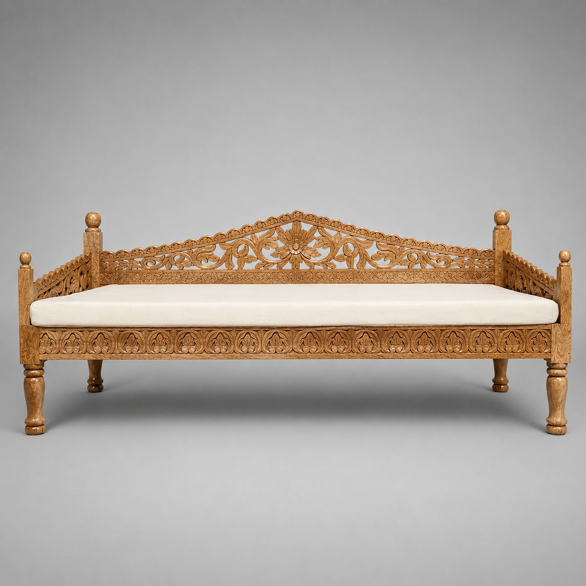 Large hand carved Indian wooden daybed with floral backrest in natural timber