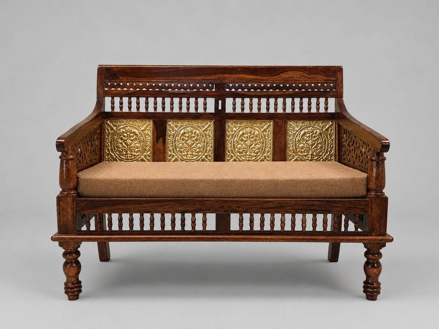 Compact Indian wooden daybed with four decorative brass floral panels and brown upholstered mattress