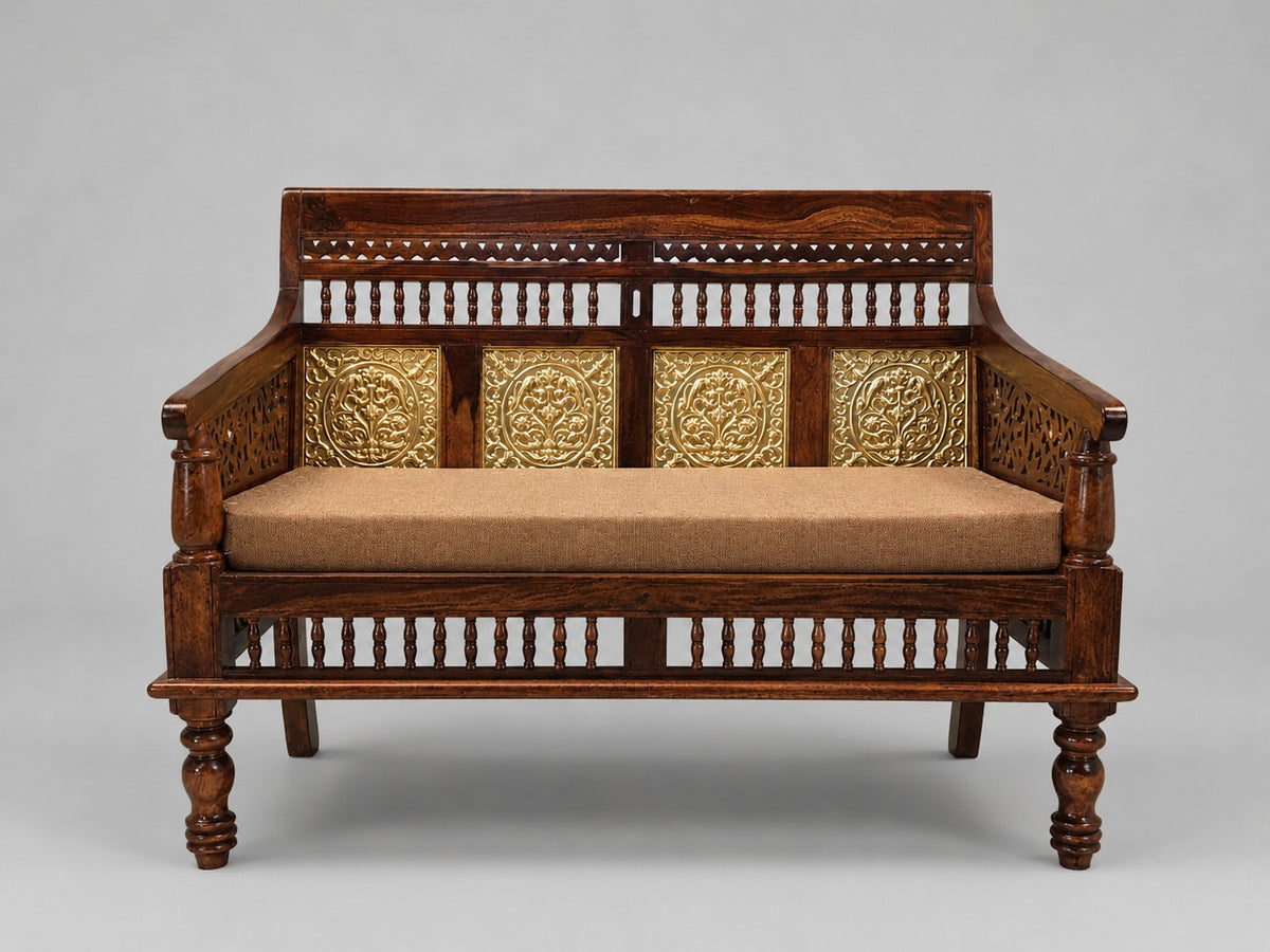 Compact Indian wooden daybed with four decorative brass floral panels and brown upholstered mattress