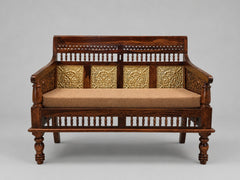 Compact Indian wooden daybed with four decorative brass floral panels and brown upholstered mattress